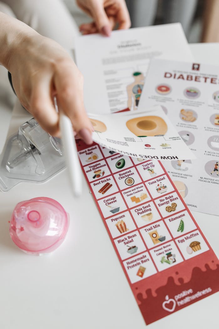 Informative diabetes pamphlets and dietary guide with hand interaction.